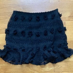 Adorable black skirt with puffy embellishments